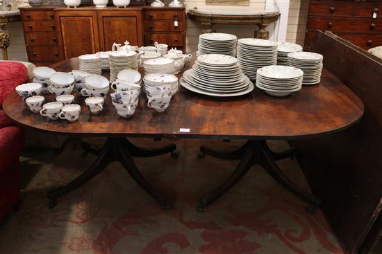 A George III mahogany twin pillar dining table, circa 1800, extends to 12ft 3in. x 5ft 2.5in.